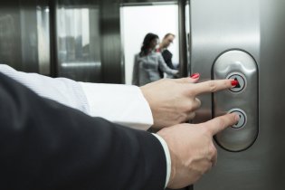 Couple waiting on elevator